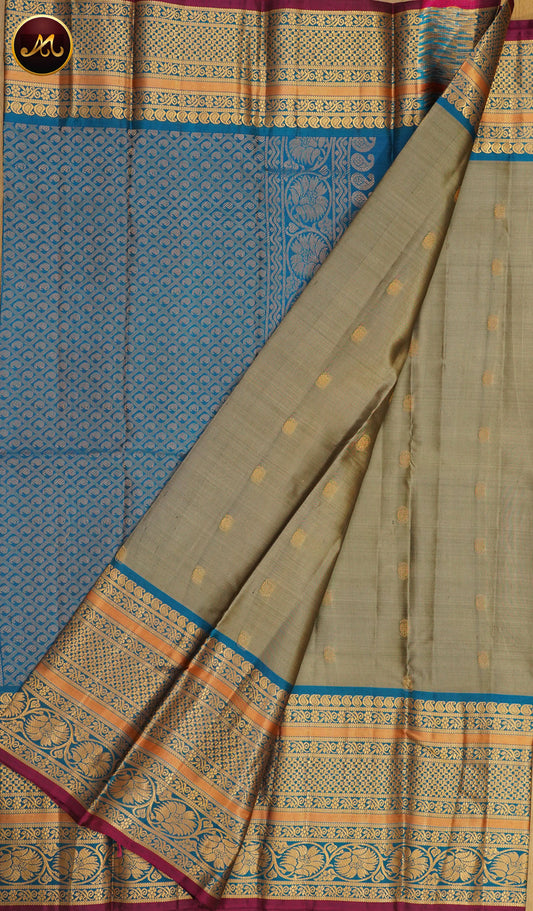 Pure Kanchi Silk Saree with body in grey colour With Buttas allover and Peocock Blue Long Border border