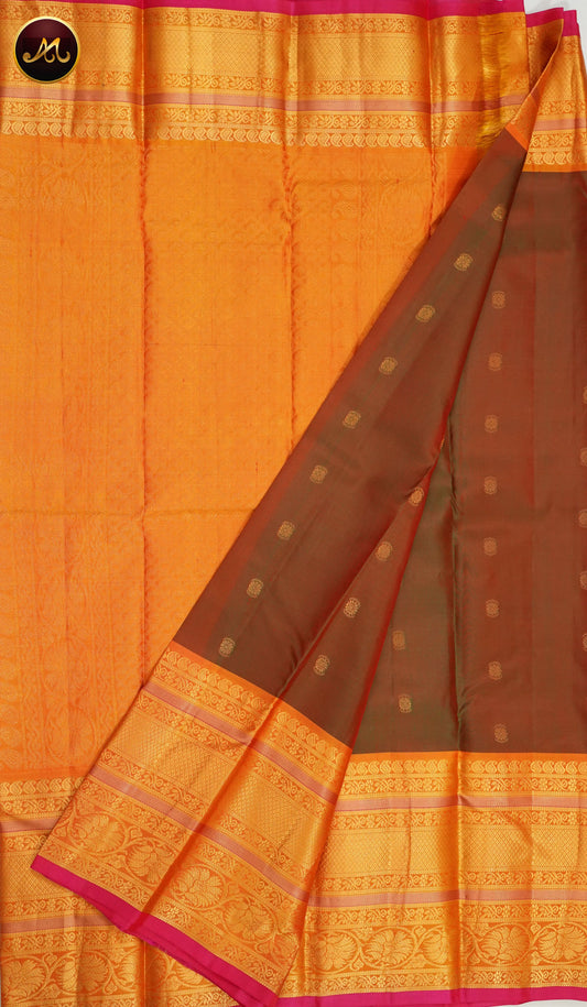 Pure Kanchi Silk Saree with body in Anjeer colour and Buttas allover and Orange Long Border