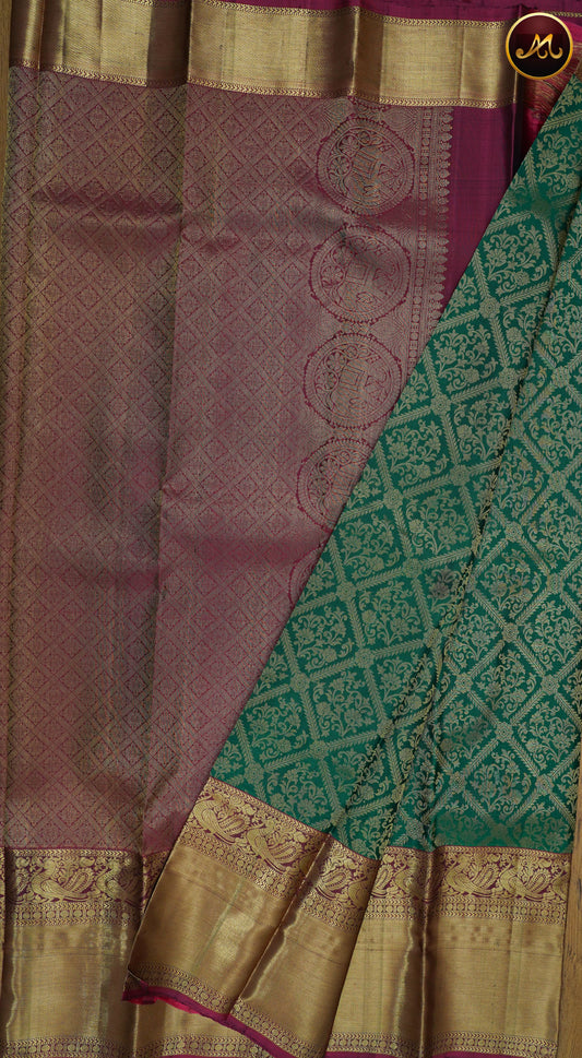 Kanchivaram Pure Silk Saree in Bottle Green and Grape Wine colour combination with brocade work, long and short border in gold zari and rich pallu