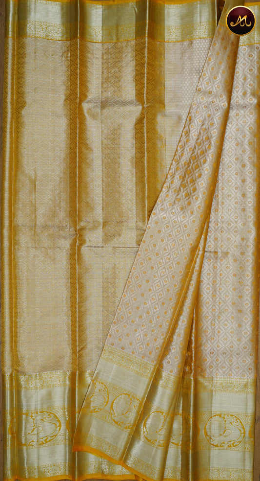Kanchivaram Pure Silk Saree in yellow with self combination, long and short border in gold zari and rich pallu