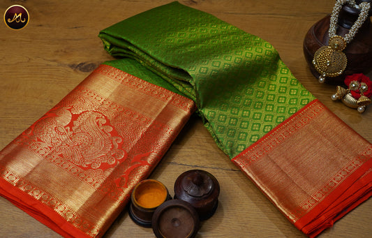 Kanchivaram Pure Silk Saree in parrot green and orange combination with brocade work, long short border in gold zari and rich pallu