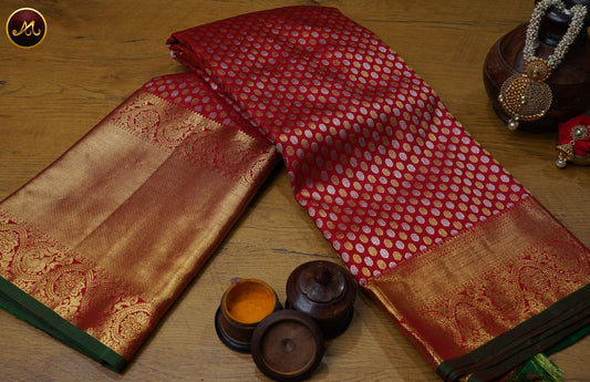 Kanchivaram Pure Silk Saree in red and green combination with brocade work, koravai long and short border in gold zari and rich pallu