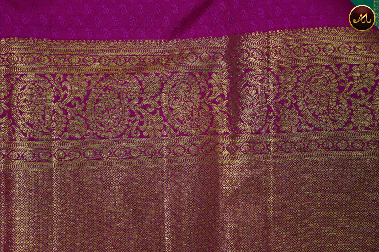 Kanchivaram Pure Silk Saree in rama green and pink combination, brocade work, long and short border in gold zari and rich pallu