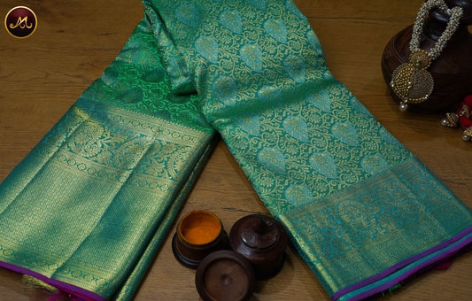 Kanchivaram Pure Silk Saree in rama green and pink combination, brocade work, long and short border in gold zari and rich pallu