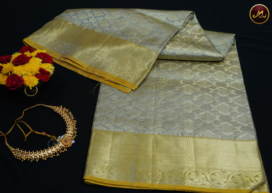 Kanchivaram Pure Silk Tissue Saree in grey and feni greek combination with emboss work, gold zari border and rich pallu