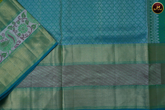 Kanchivaram Pure Silk Tissue Saree in parrot green with ananda blue combination, brocade and emboss work, long and short kalamkari border in gold zari and rich pallu