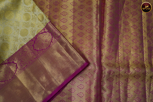 Kanchivaram Pure Silk Tissue Saree in beige with rani pink combination, emboss work, long and short border with gold zari and rich pallu