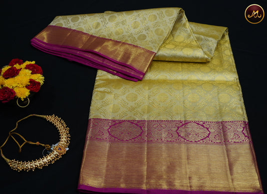 Kanchivaram Pure Silk Tissue Saree in beige with rani pink combination, emboss work, long and short border with gold zari and rich pallu