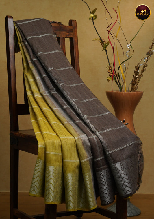 Bhagelpuri Cotton Saree in yellow and brown colour with thread stripes all over the body and silver border