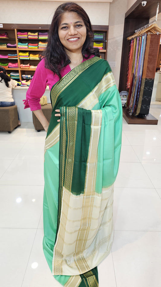 Mysore crepe silk saree with KSIC Finish in mint green with dark green in bentex border pattern