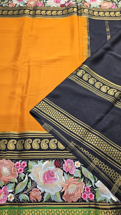 Mysore crepe silk saree with KSIC Finish in orange with black in  embroidery pattern
