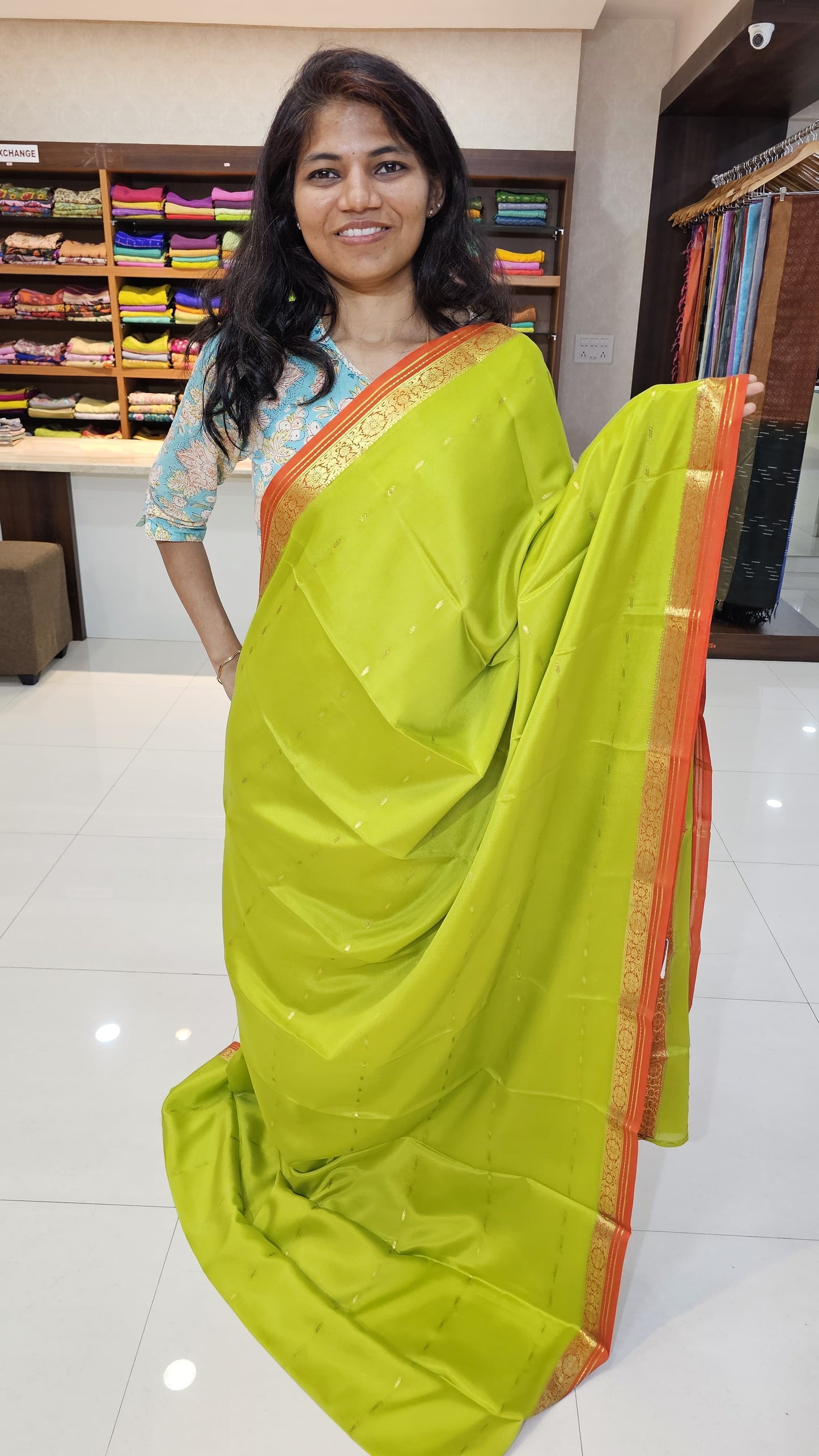 Mysore crepe silk saree with KSIC Finish in lemon green with orange in small zari motifs pattern