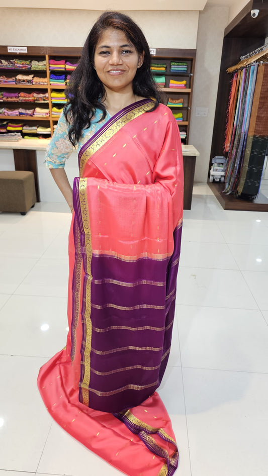 Mysore crepe silk saree with KSIC Finish in peach pink with purple in small zari motifs pattern