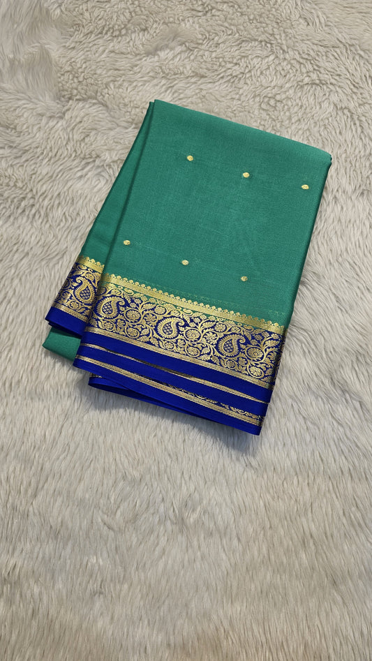 Mysore crepe silk saree with KSIC Finish in rama green with royal blue in small zari motifs pattern