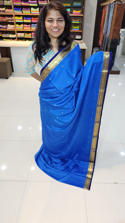 Mysore crepe silk saree with KSIC Finish in ananada Blue with Navy Blue in small zari motifs pattern