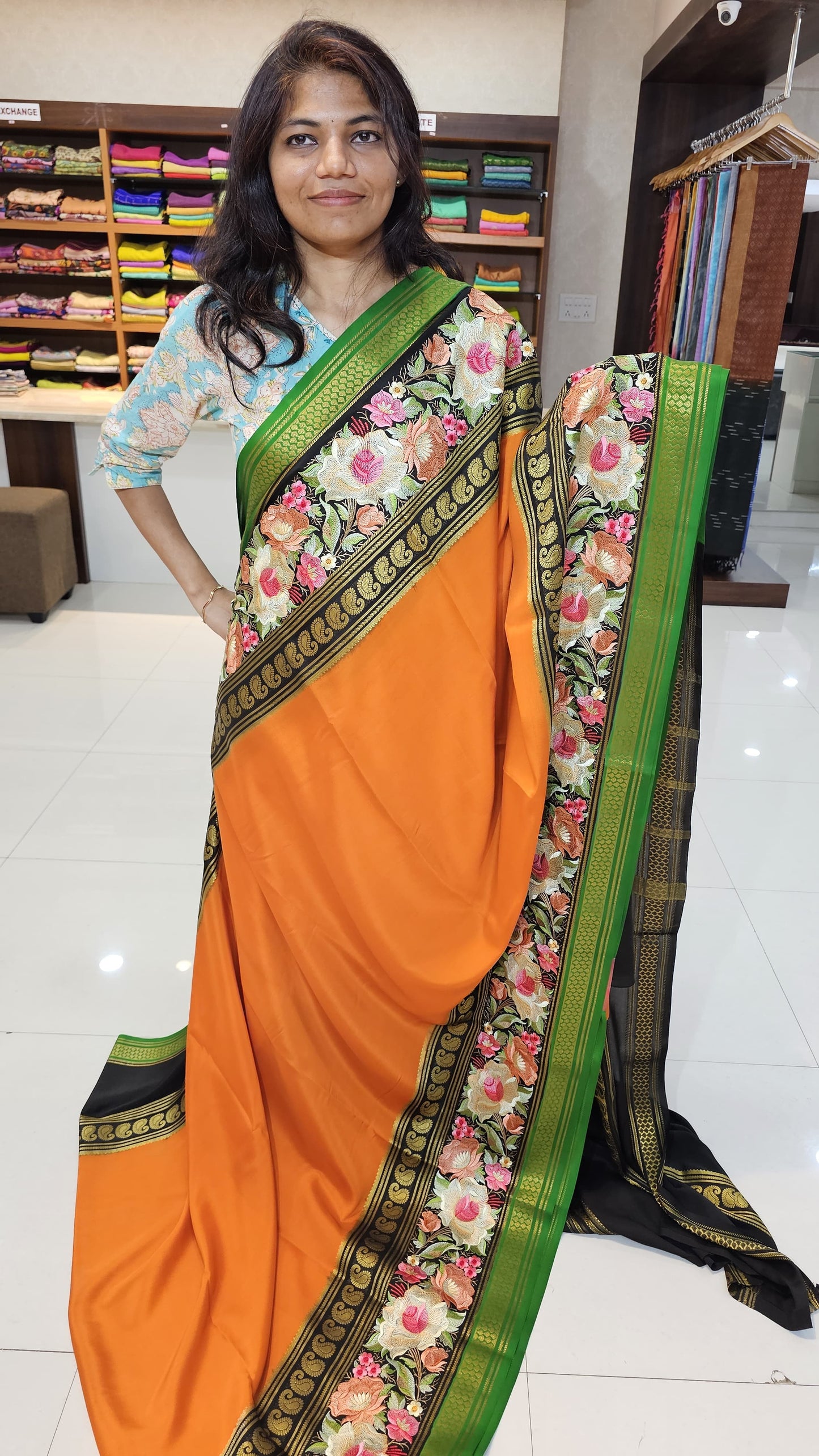 Mysore crepe silk saree with KSIC Finish in orange with black in  embroidery pattern