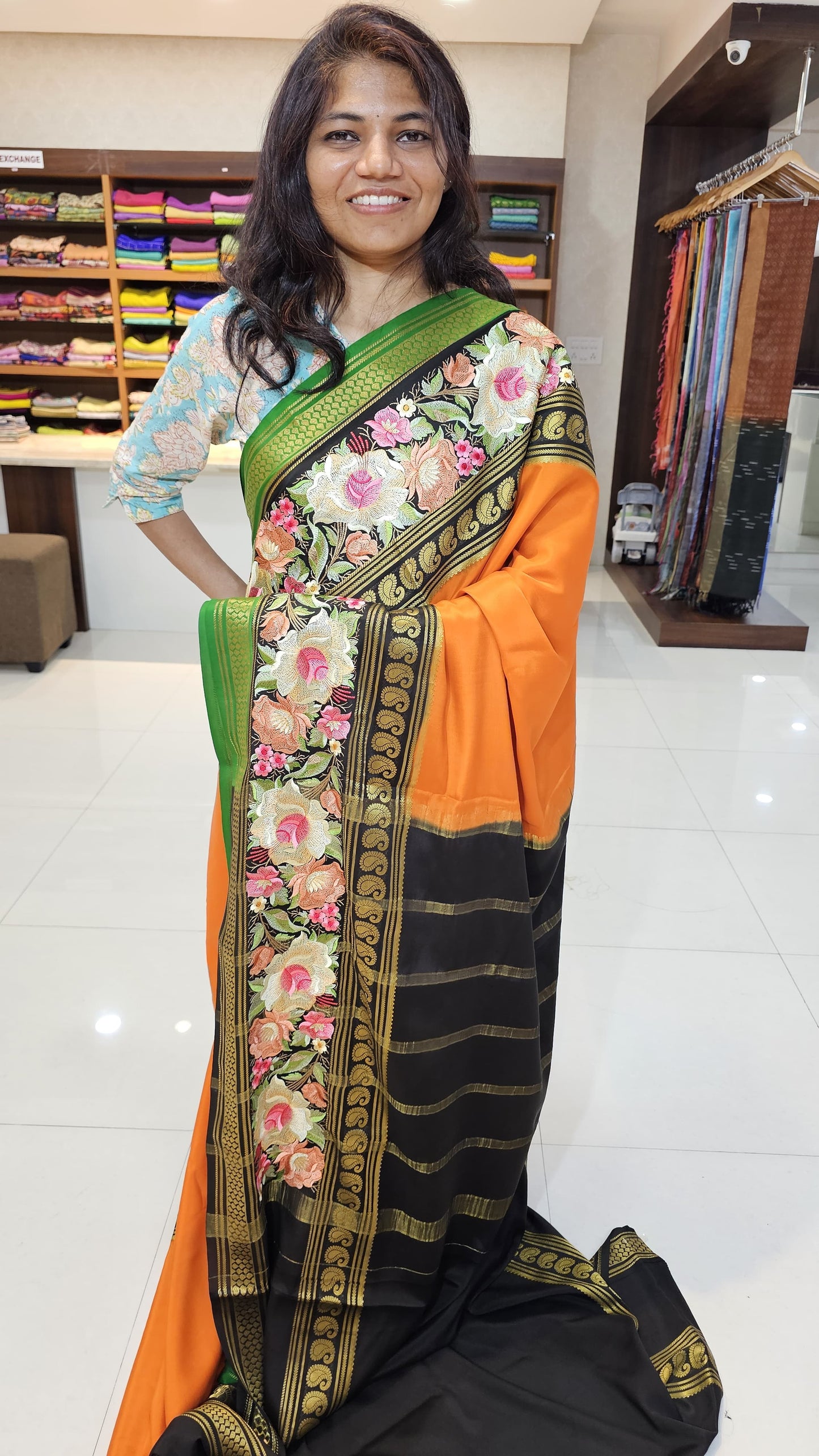 Mysore crepe silk saree with KSIC Finish in orange with black in  embroidery pattern