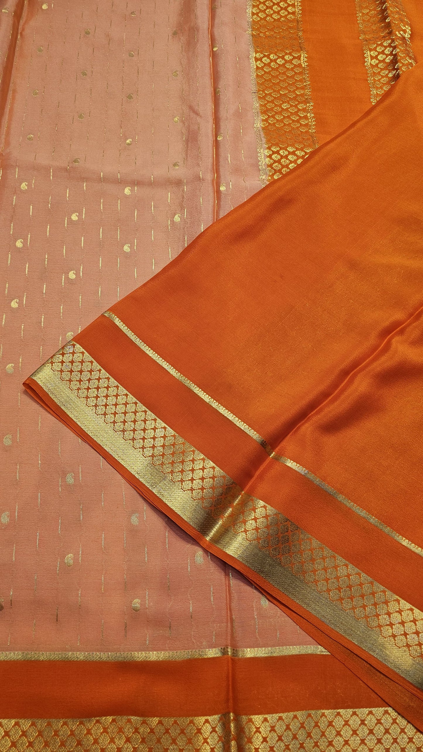 Mysore crepe silk saree with KSIC Finish in peach with orange in allover buttas pattern
