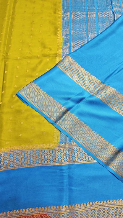 Mysore crepe silk saree with KSIC Finish in mehendi green with ananda blue in allover buttas pattern