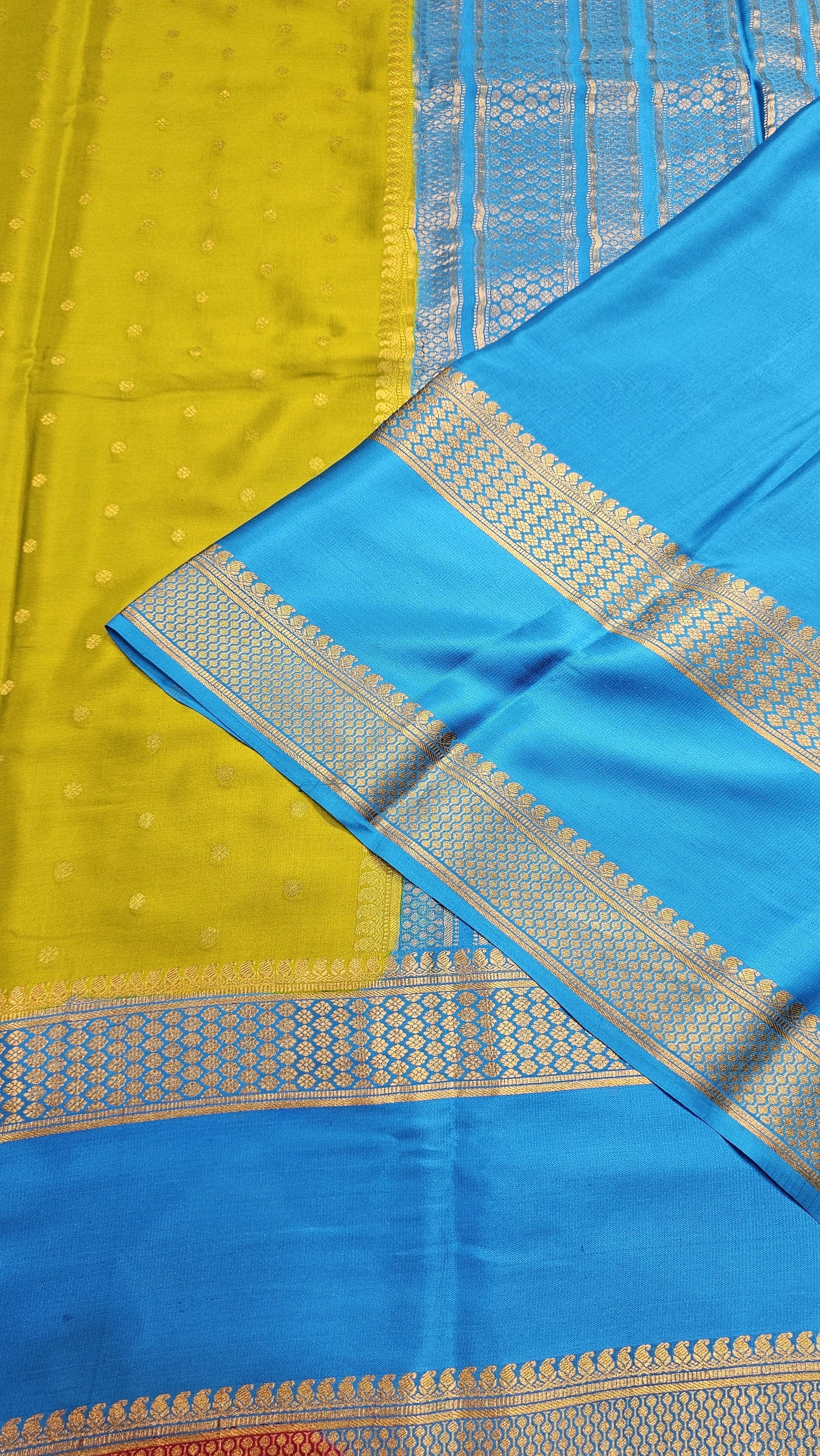 Mysore crepe silk saree with KSIC Finish in mehendi green with ananda blue in allover buttas pattern