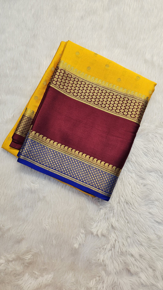 Mysore crepe silk saree with KSIC Finish in mango yellow with maroon in allover buttas pattern