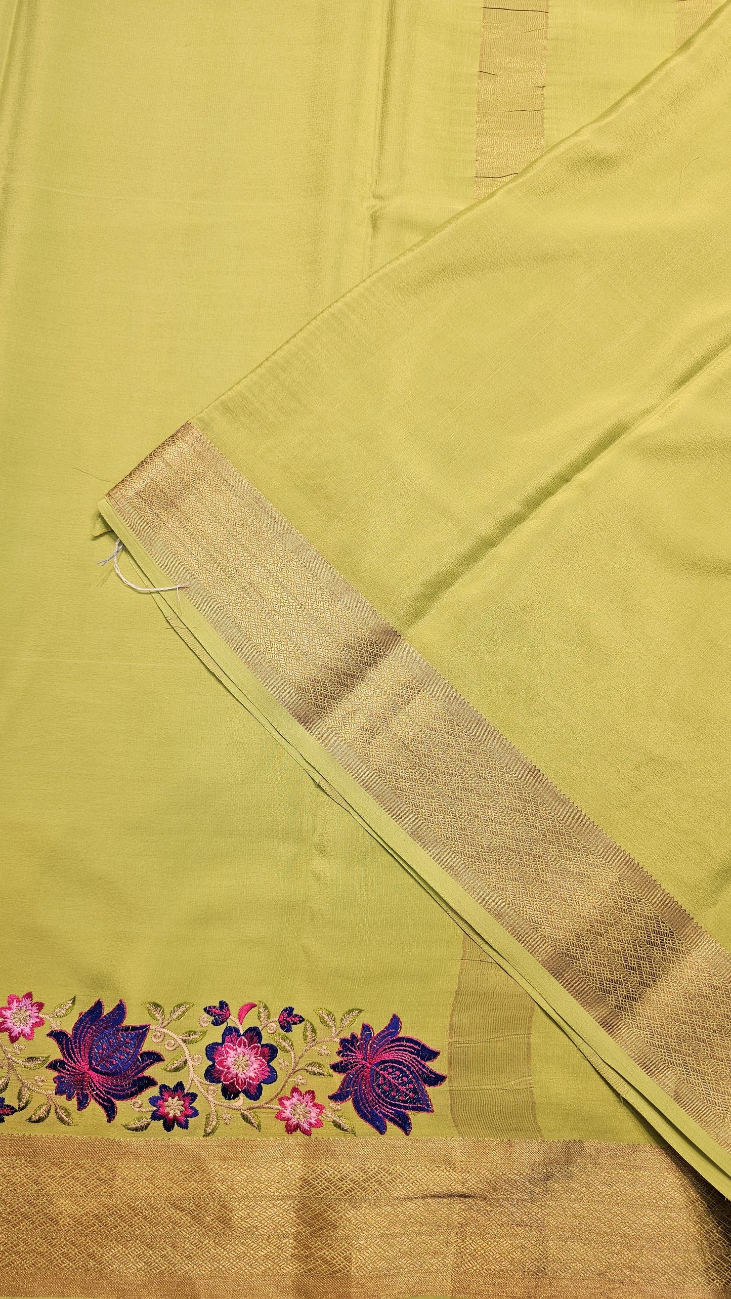 Mysore crepe silk saree with KSIC Finish in pista green in one side cutwork pattern