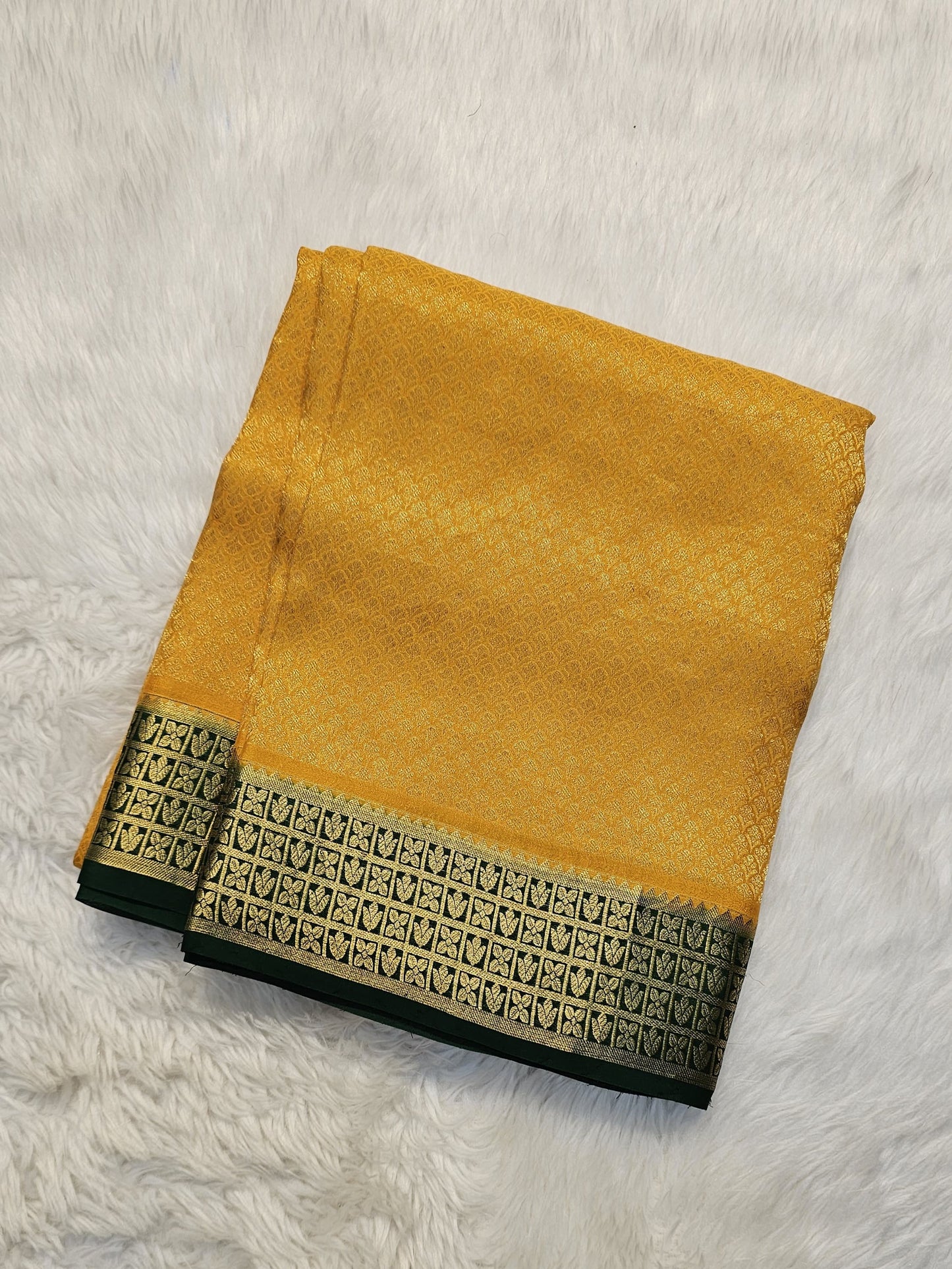 Mysore crepe silk saree with KSIC Finish in mango yellow, with green in brocade zari pattern