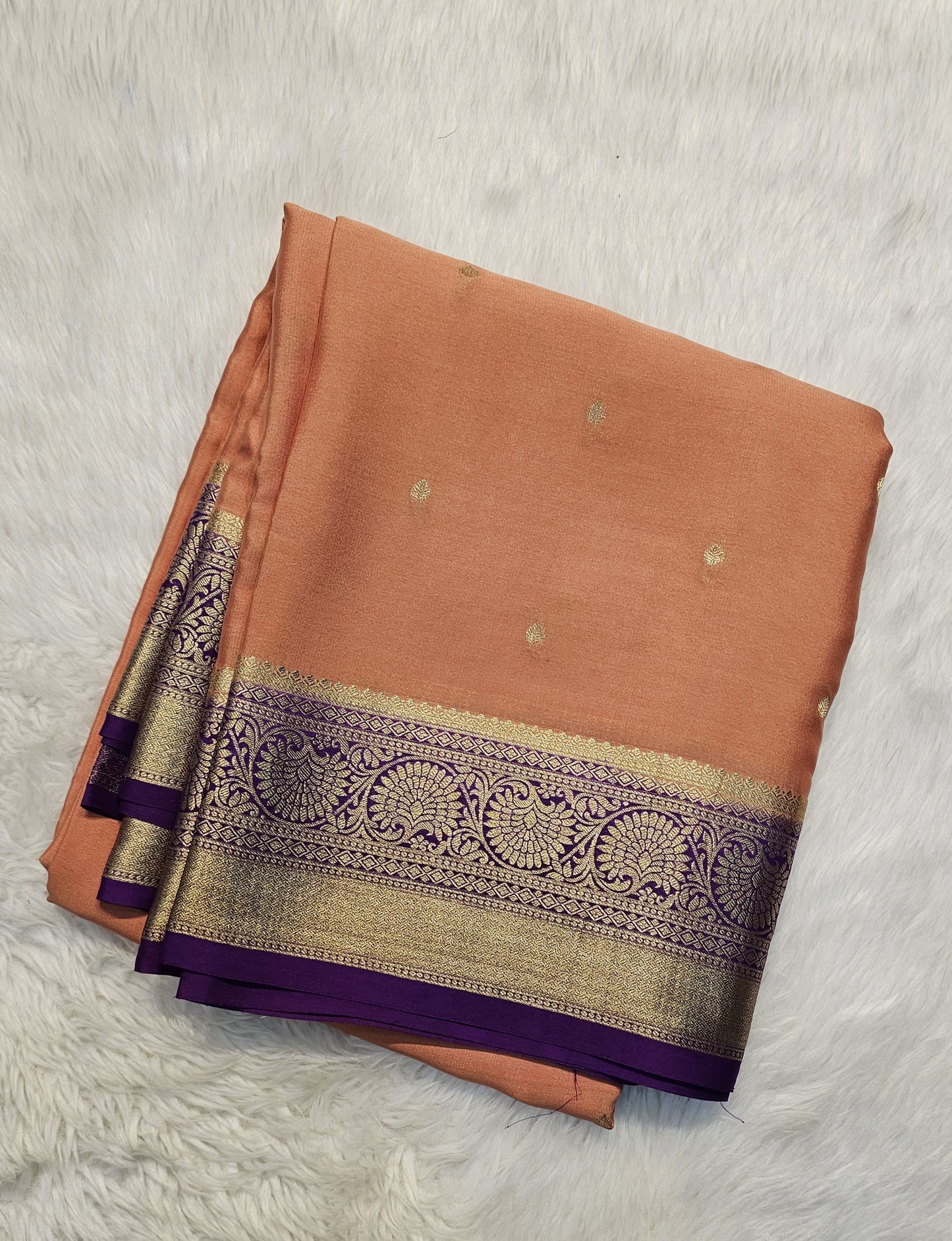 Mysore crepe silk saree with KSIC Finish in rust orange with purple in allover zari buttas pattern