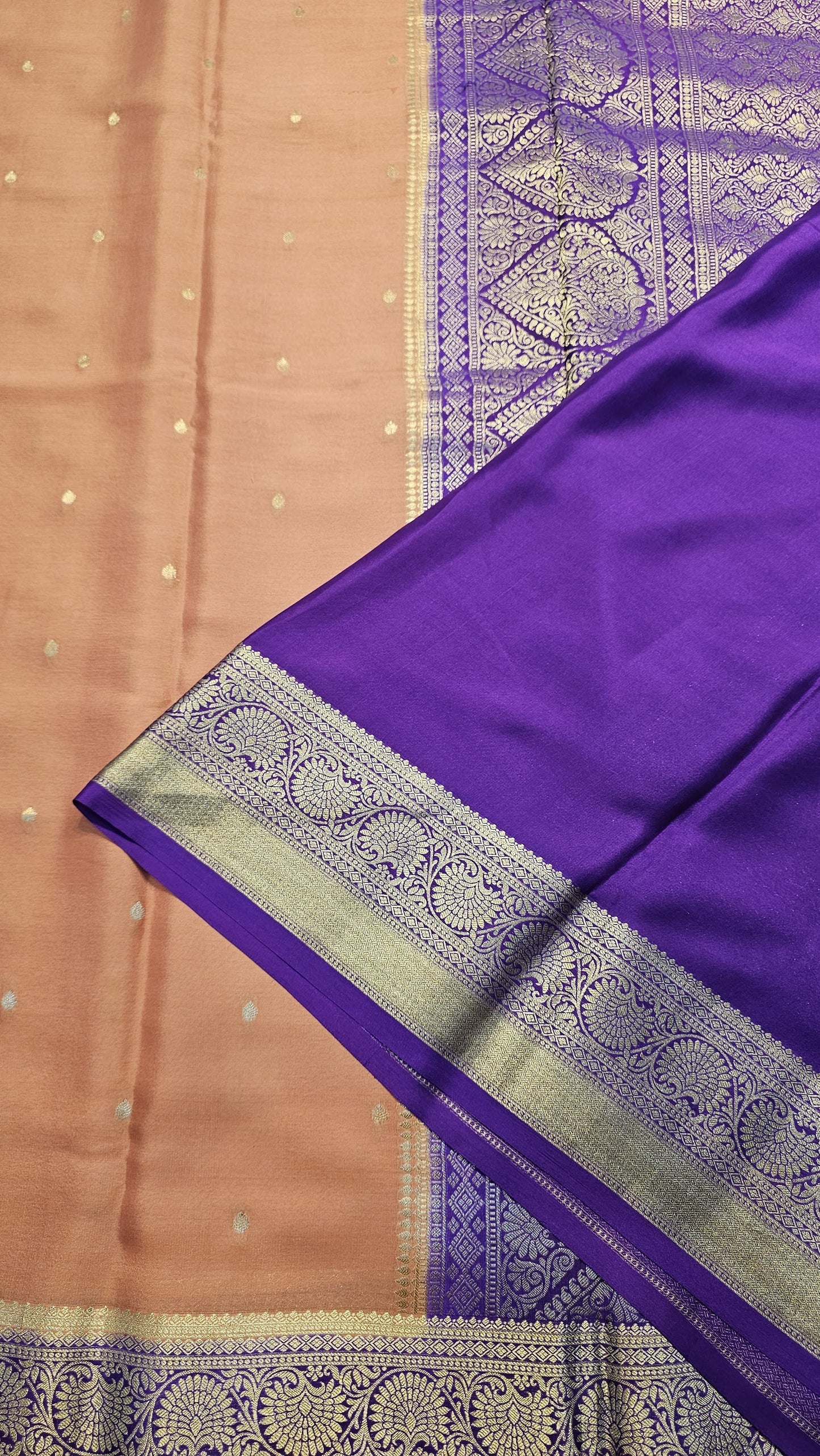 Mysore crepe silk saree with KSIC Finish in rust orange with purple in allover zari buttas pattern