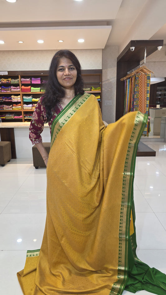 Mysore crepe silk saree with KSIC Finish in mustard with green in allover zari brocade pattern