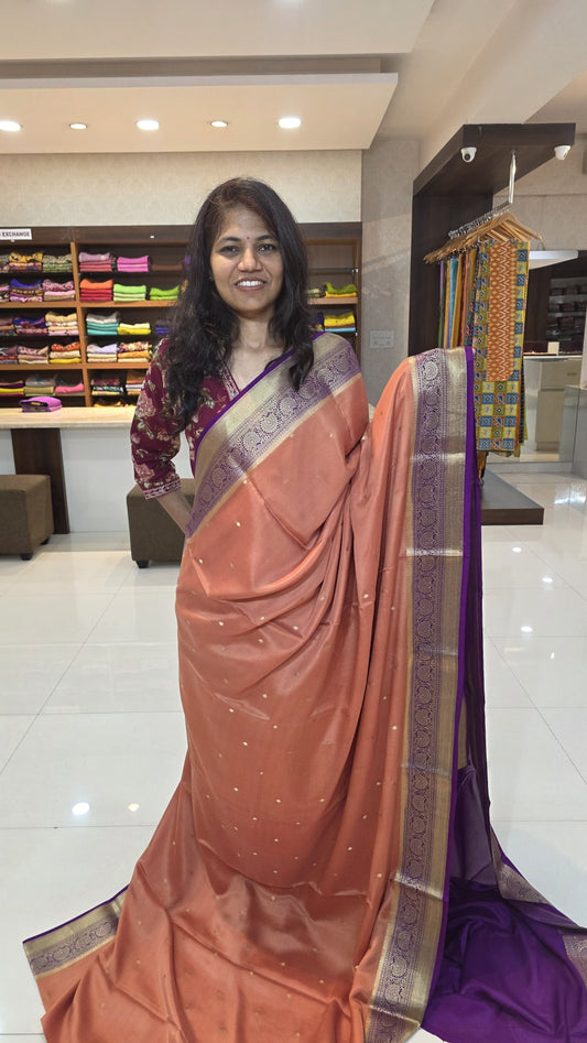 Mysore crepe silk saree with KSIC Finish in rust orange with purple in allover zari buttas pattern