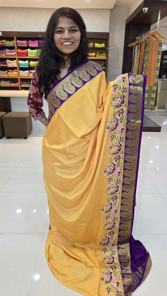Mysore crepe silk saree with KSIC Finish in sandel with purple in one side cutwork with mango border