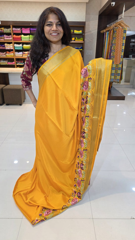 Mysore crepe silk saree with KSIC Finish in mango yellow self in one side cutwork pattern