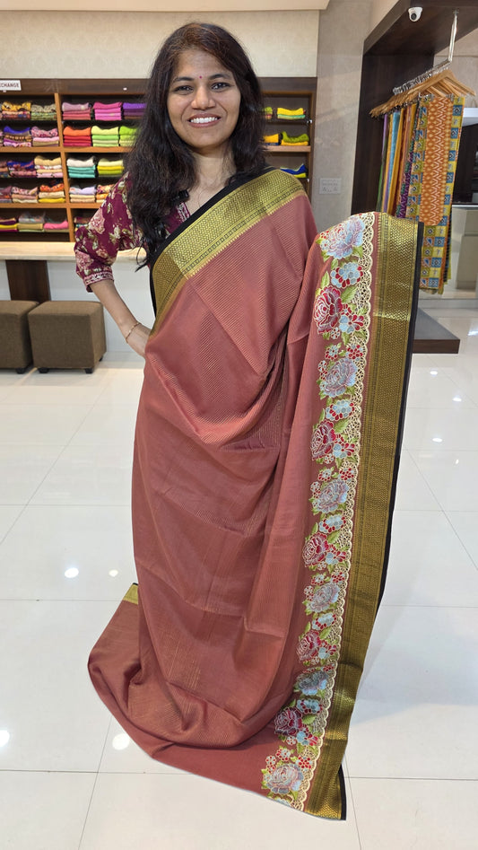 Mysore crepe silk saree with KSIC Finish in light brick red with black in one side cutwork pattern
