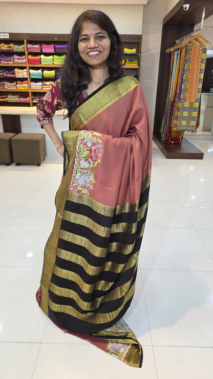 Mysore crepe silk saree with KSIC Finish in light brick red with black in one side cutwork pattern