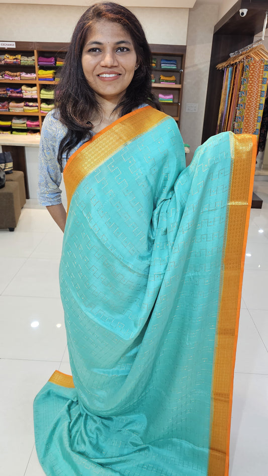 Mysore crepe silk saree with KSIC Finish in ice blue with orange in zig zag pattern