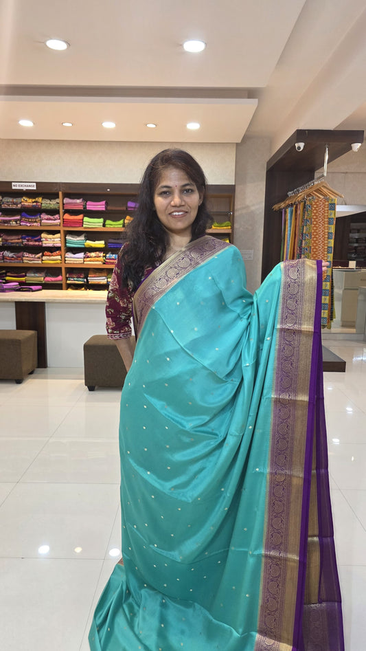 Mysore crepe silk saree with KSIC Finish in sky blue with purple in allover zari buttas pattern