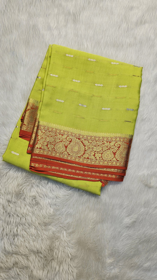 Mysore crepe silk saree with KSIC Finish in lemon green with orange in mango border pattern