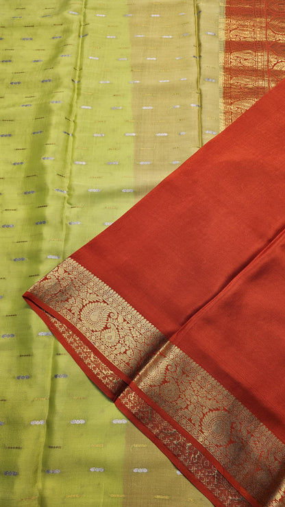 Mysore crepe silk saree with KSIC Finish in lemon green with orange in mango border pattern