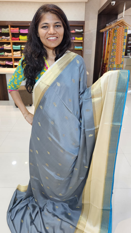Mysore crepe silk saree with KSIC Finish in grey with half white in allover zari buttas pattern