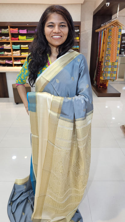 Mysore crepe silk saree with KSIC Finish in grey with half white in allover zari buttas pattern