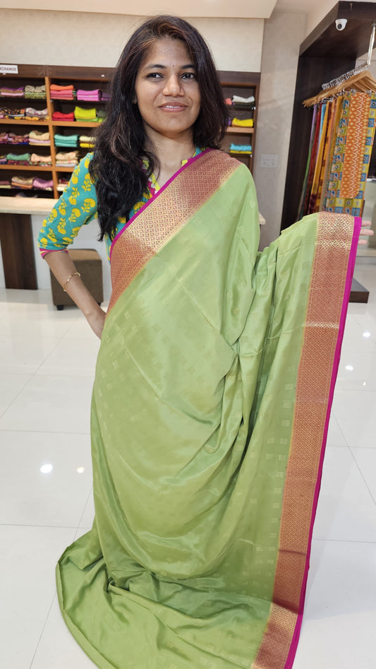 Mysore crepe silk saree with KSIC Finish in pista green with rani pink in checks pattern