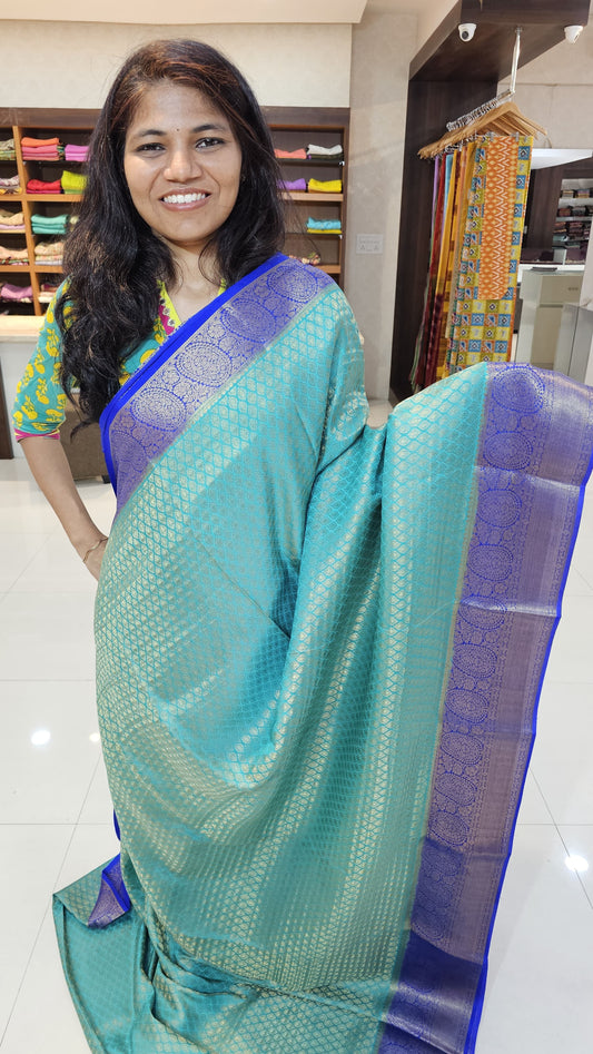 Mysore crepe silk saree with KSIC Finish in rama green with royal blue in brocade zari pattern