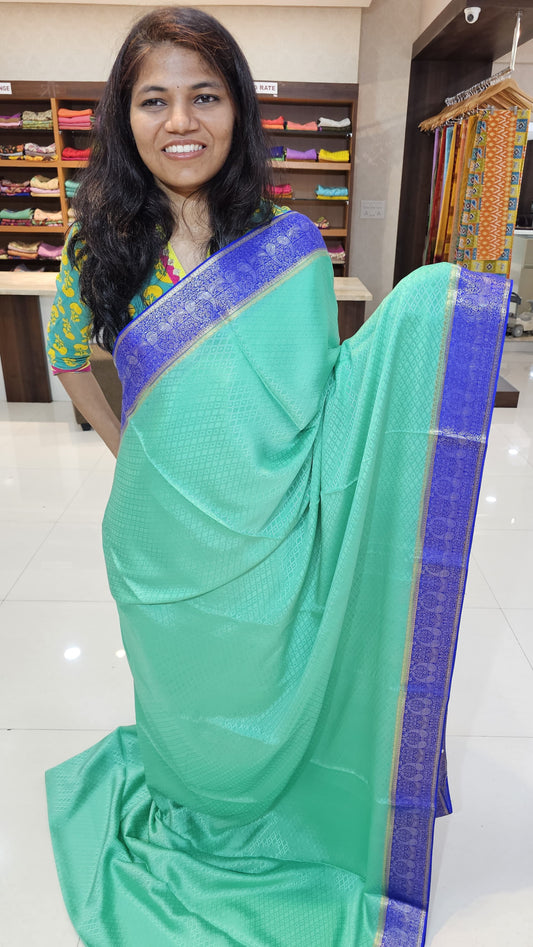 Mysore crepe silk saree with KSIC Finish in rama green with royal blue in mango motifis border
