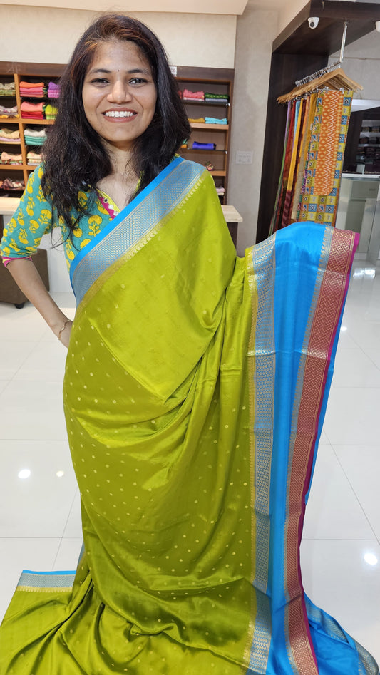 Mysore crepe silk saree with KSIC Finish in mehendi green with ananda blue in allover buttas pattern