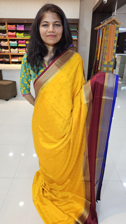 Mysore crepe silk saree with KSIC Finish in mango yellow with maroon in allover buttas pattern