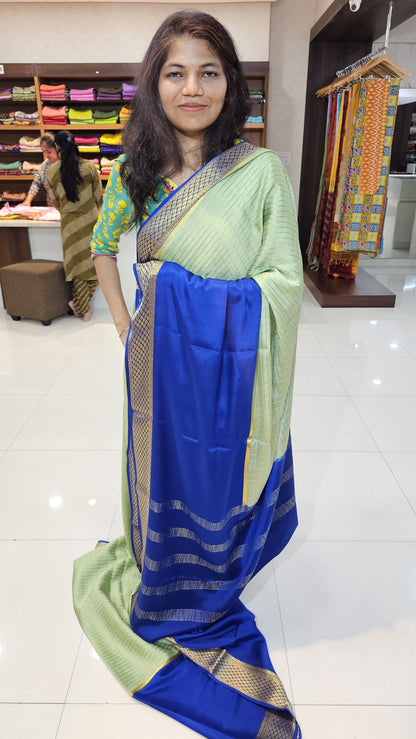 Mysore crepe silk saree with KSIC Finish in mint with ink blue in half and half checks pattern