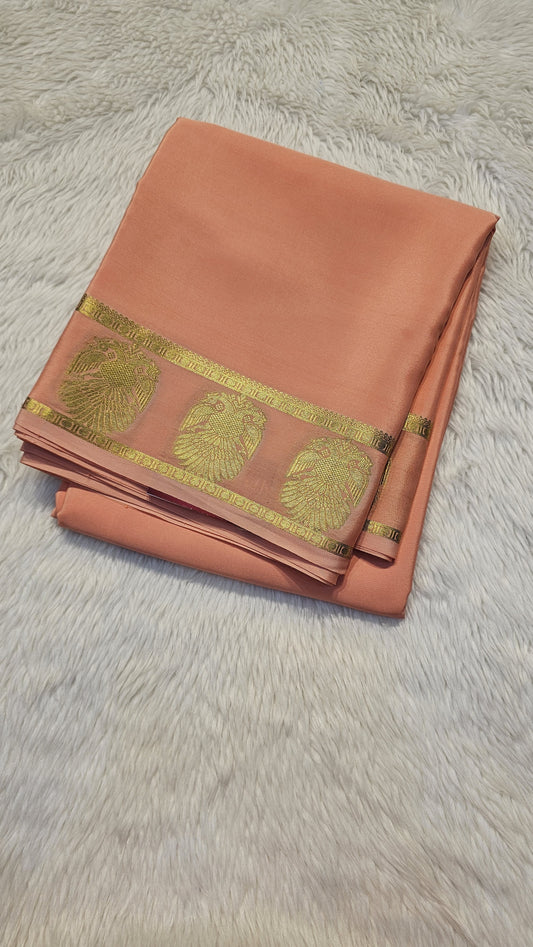 mysore crepe silk sarees in KSIC Finish in light peach self in ganda berunda border