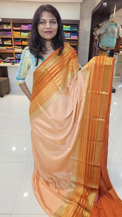 mysore crepe silk sarees in KSIC Finish in peach with rust orange in bentex border