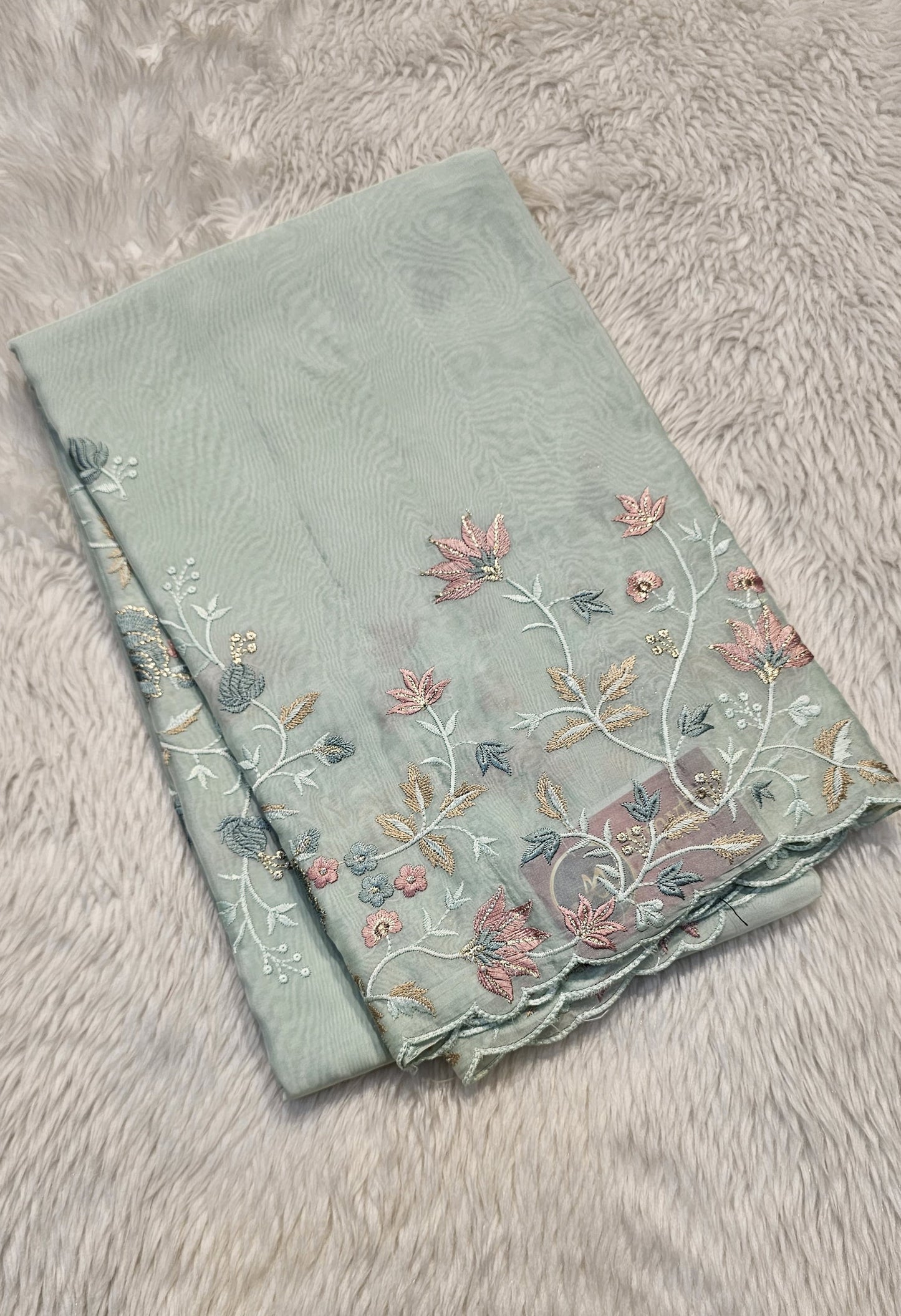 Semi organza fancy saree in light sea green self with allover embroidery work